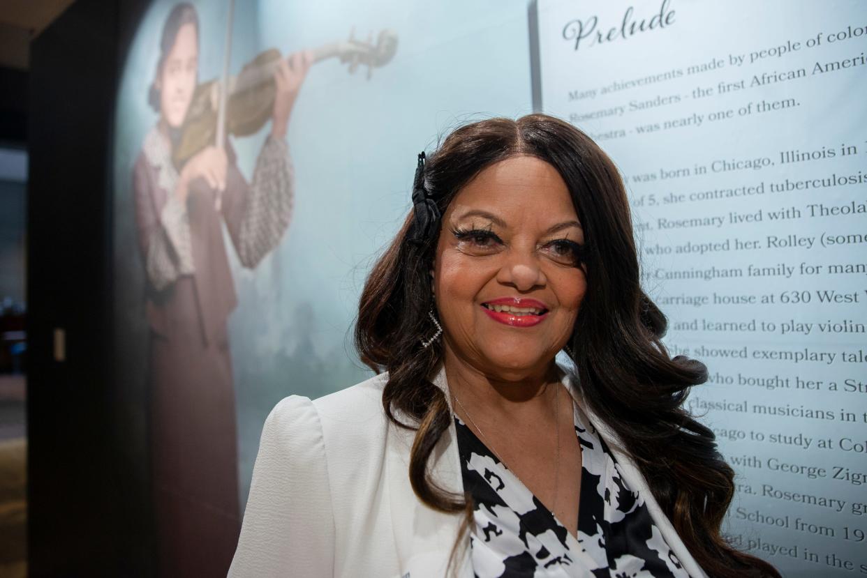 Helen Ursery-Binion stands next to in the "Trailblazers" exhibit about her mother, Rosemary Sanders, in The History Museum in South Bend in June. Sanders was the first Black musician in the South Bend Symphony Orchestra in 1940.