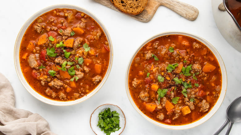 two bowls of sausage lentil soup