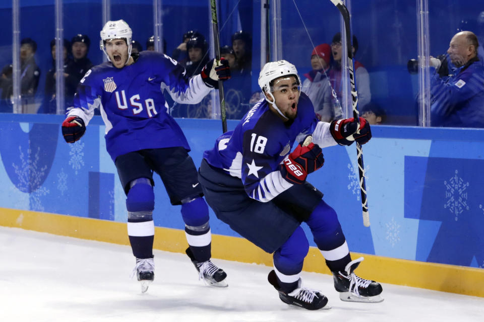 FILE - Jordan Greenway (18), of the United States, celebrates with teammate Bobby Sanguinetti (22) after scoring a goal during the second period of the preliminary round of the men's hockey game against Slovenia at the 2018 Winter Olympics in Gangneung, South Korea, Wednesday, Feb. 14, 2018. The 2018 Olympics without NHL talent offered a glimpse of things to come for players who hadn't yet reached the best hockey league in the world. (AP Photo/Frank Franklin II, File)