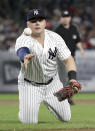 New York Yankees first baseman Luke Voit tosses the ball to starting pitcher Luis Severino for the out on Boston Red Sox's Andrew Benintendi during the fifth inning of a baseball game Wednesday, Sept. 19, 2018, in New York. (AP Photo/Julio Cortez)