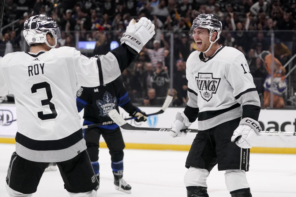 Los Angeles Kings center Gabriel Vilardi, right, celebrates his goal with defenseman Matt Roy during the second period of an NHL hockey game against the Toronto Maple Leafs Saturday, Oct. 29, 2022, in Los Angeles. (AP Photo/Mark J. Terrill)