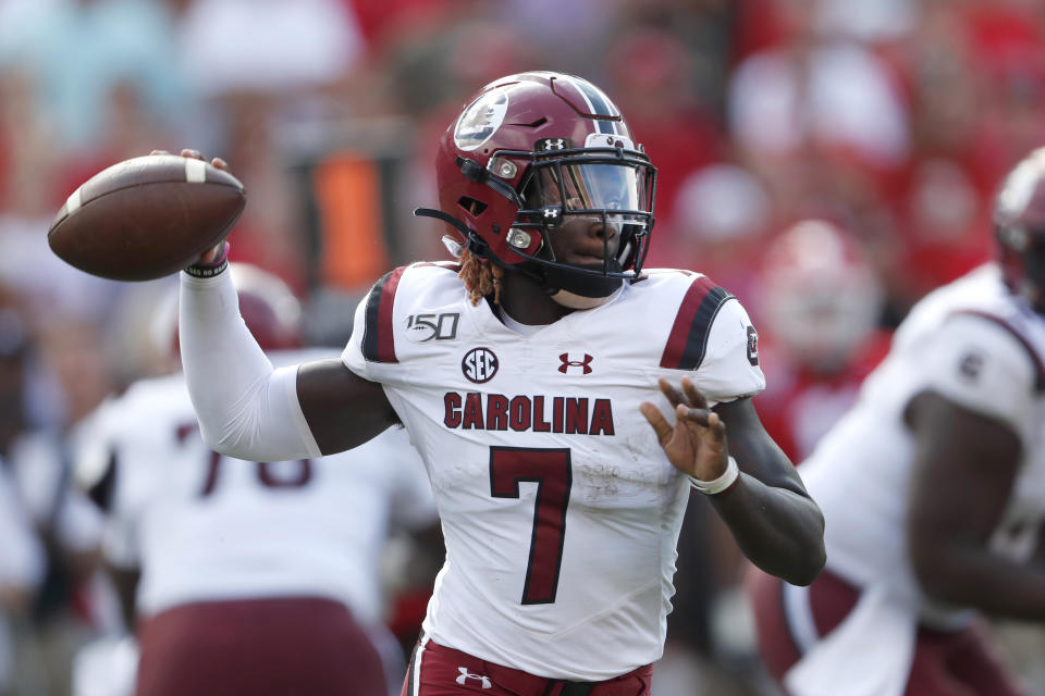 South Carolina quarterback Dakereon Joyner (7) throws on the run in the second half of an NCAA college football game against Georgia, Saturday, Oct. 12, 2019, in Athens, Ga. (AP Photo/John Bazemore)