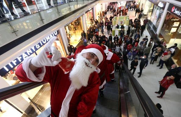 Queue up: Father Christmas worth more than the elves (image: Getty/AFP)