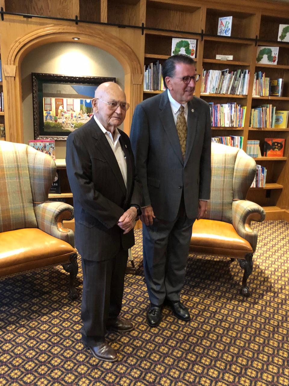 Dr. Paul Engler, left, makes his annual presentation of $1 million to agricultural and business colleges at West Texas A&M University, with President Walter Wendler, right, at the disbursement ceremony Wednesday in Canyon.