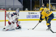 Nashville Predators center Matt Duchene (95) shoots against Columbus Blue Jackets goaltender Elvis Merzlikins (90) in the second period of an NHL hockey game Saturday, Jan. 16, 2021, in Nashville, Tenn. (AP Photo/Mark Humphrey)