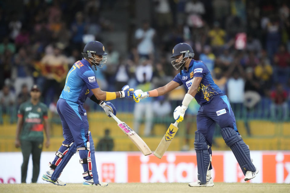 Sri Lanka's Sadeera Samarawickrama, right, and Dasun Shanaka cheer each others during the Asia Cup cricket match between Sri Lanka and Bangladesh in Colombo, Sri Lanka on Saturday, Sep. 9. (AP Photo/Eranga Jayawardena)