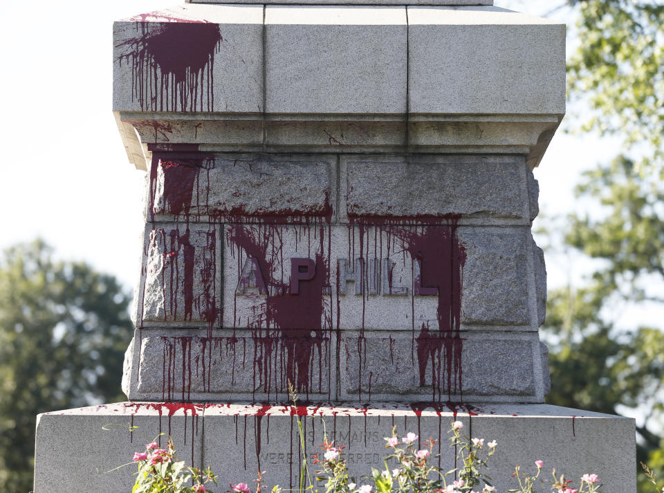 Paint appears on the statue of Confederate General A. P. Hill as it was vandalized overnight in Richmond, Va., Wednesday, Aug. 22, 2018. The vandalism comes after protesters at North Carolina's flagship university toppled a Confederate monument in the heart of campus earlier this week. Richmond has been debating what to do with its most prominent Confederate monuments along Monument Avenue in a different part of the city. The Hill statue hasn't been part of that discussion.(AP Photo/Steve Helber)