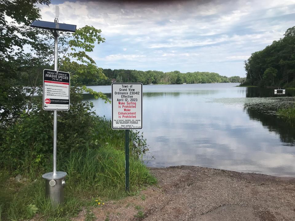 A sign installed at Diamond Lake in Bayfield County lists the prohibition on wake surfing.