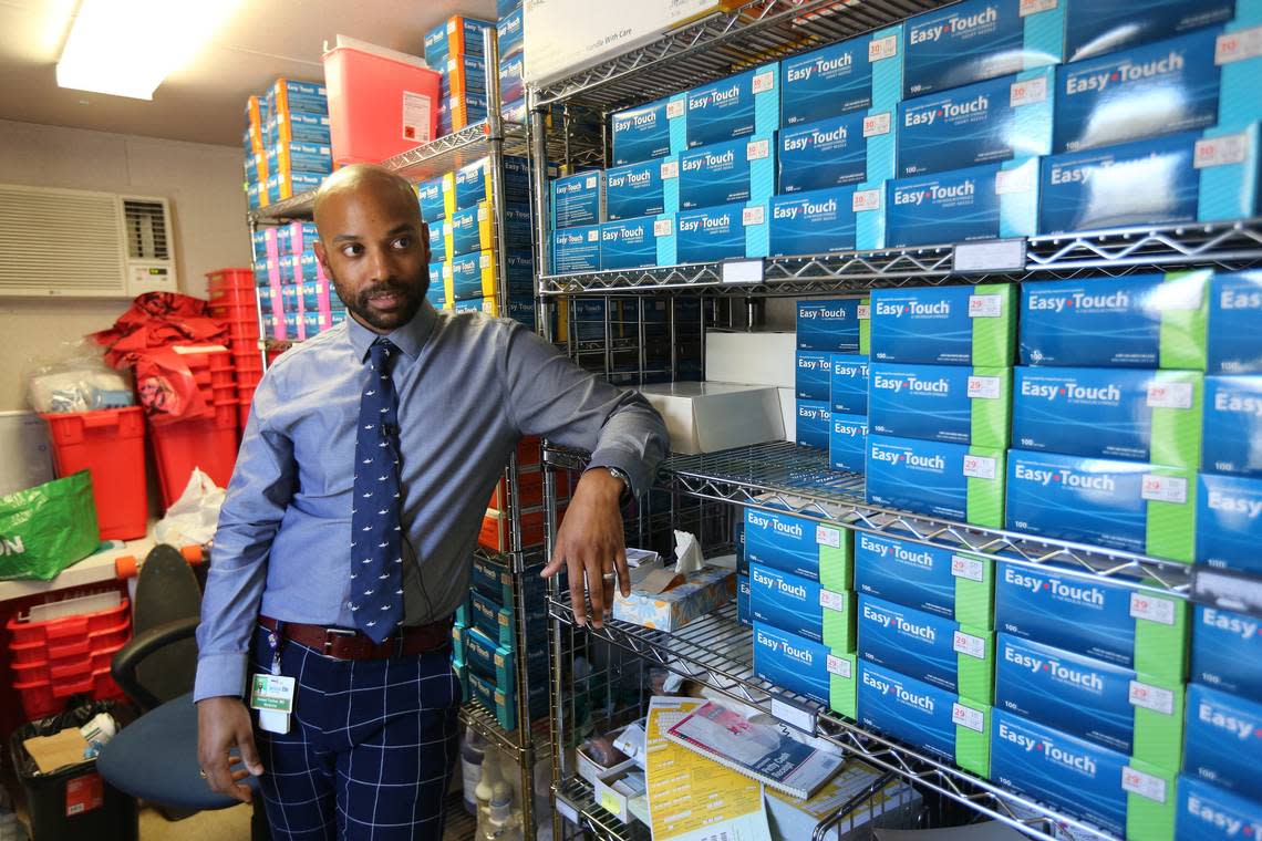 Dr. Hansel Tookes, who started Miami’s IDEA Needle Exchange, stands by stacks of syringes in the program’s supply room Friday, Feb. 15, 2019. IDEA is a University of Miami program that provides addicts with clean needles to prevent transmission of disease and Narcan, a substance that reverses opioid overdoses.