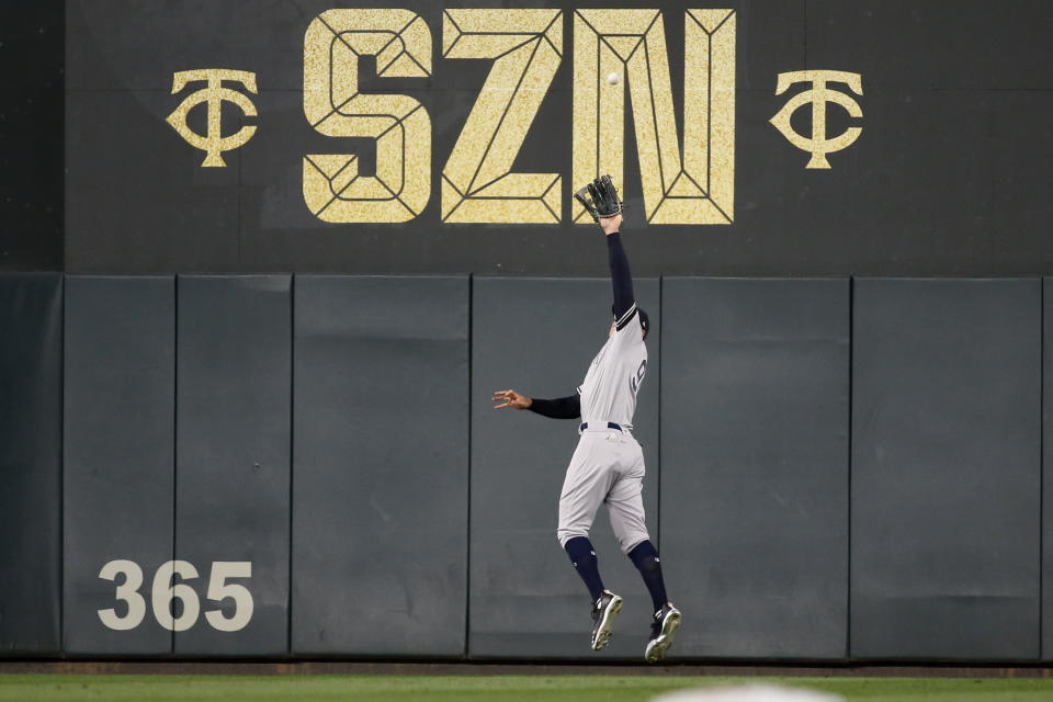 New York Yankees right fielder Aaron Judge catches a fly ball hit by Minnesota Twins' Miguel Sano during the sixth inning in Game 3 of a baseball American League Division Series, Monday, Oct. 7, 2019, in Minneapolis. (AP Photo/Bruce Kluckhohn)