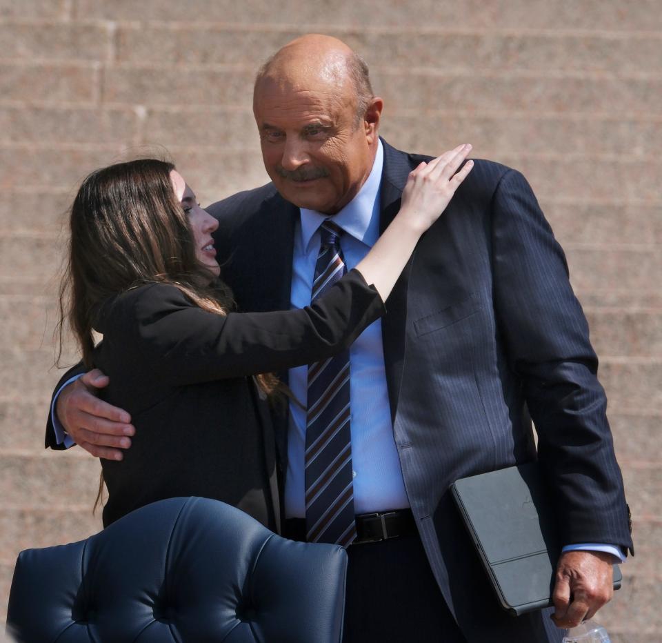 Lea Glossip, wife of Richard Glossip, and Phil McGraw hug Tuesday after they addressed the crowd at a Justice Rally for Richard Glossip at the state Capitol.
