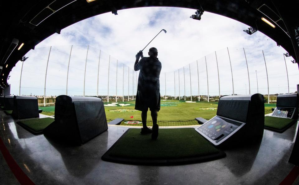 Gabe Luchetta hits balls at the new location of Top Golf in Fort Myers on Wednesday, Nov. 17, 2021. The grand opening is on Friday but the location had a soft opening and patrons are able to hit in all the bays. 