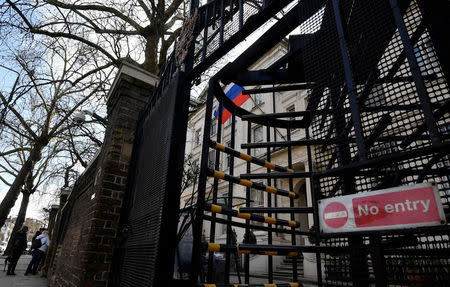 Visitors wait to enter the consular section of Russia's embassy in London, Britain, March 16, 2018. REUTERS/Toby Melville