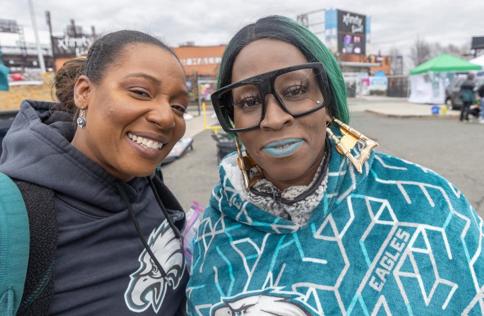 Jeanene Hill and Sharee Ivory of Camden, New Jersey, show up early and psyched for the upcoming game. Fans for the Eagles-Giants playoff game show up early to tailgate and party across from Lincoln Financial Field in Philadelphia on January 21, 2023.