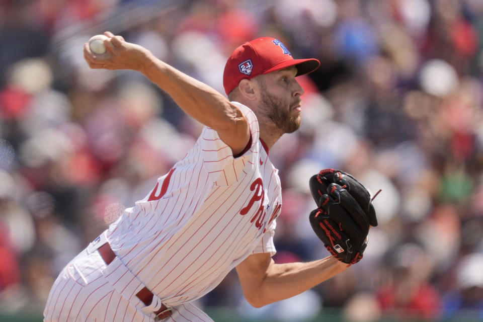 FILE - Philadelphia Phillies starting pitcher Zack Wheeler throws during the third inning of a spring training baseball game against the New York Yankees Monday, March 11, 2024, in Clearwater, Fla. Wheeler had Tommy John surgery with New York Mets medical director Dr. David Altchek in 2015 and returned two years later. He has gone 69-47 since, becoming a Philadelphia Phillies ace and signing $254 million in contracts.(AP Photo/Charlie Neibergall, File)