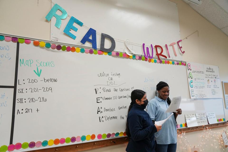 Aiven Luna and Marand Cotton discuss their reading lesson together at Mendez Middle School. Charter school company Third Future Schools was hired this summer to operate the school and bring up its students' academic achievement ratings.