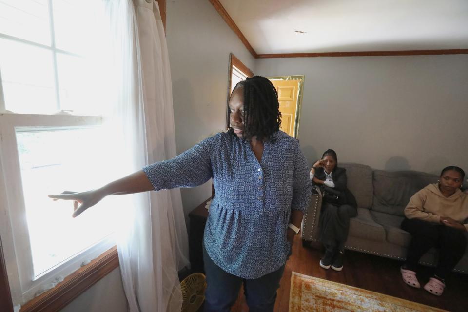 Von Charpentier gestures out the front window at Judy Adams' house in Central Nyack June 9, 2023. Adams' son, Sean Harris, died at the house after Clarkstown police went there based on a call from a social worker.