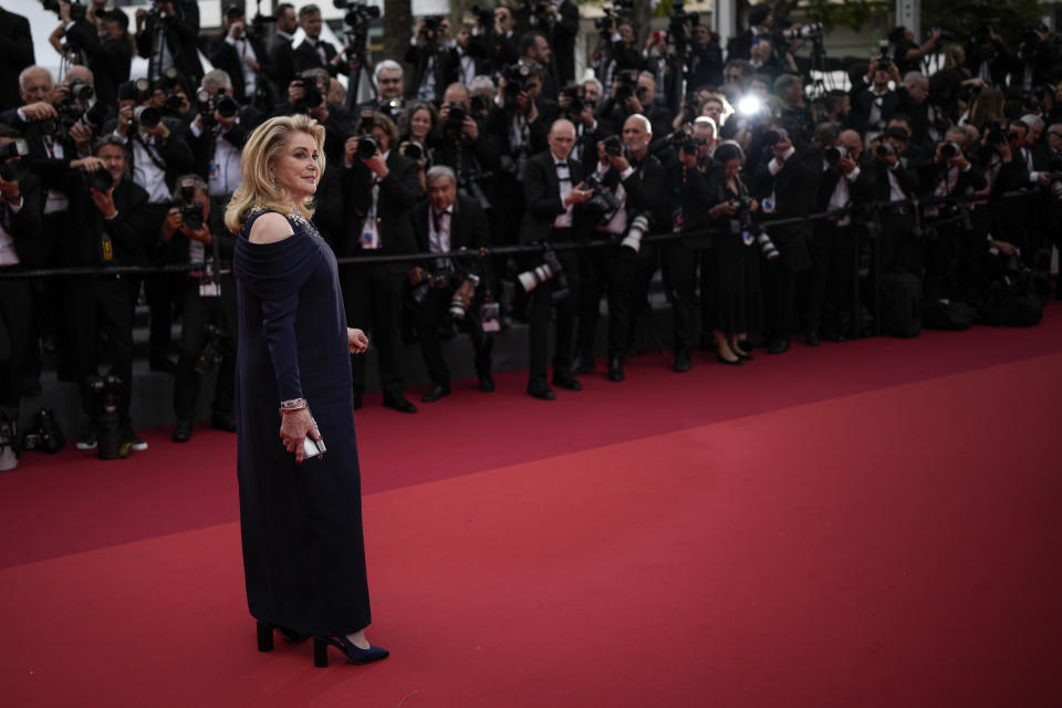 Catherine Deneuve poses for photographers upon arrival at the opening ceremony and the premiere of the film 'Jeanne du Barry' at the 76th international film festival, Cannes, southern France, Tuesday, May 16, 2023. (AP Photo/Daniel Cole)