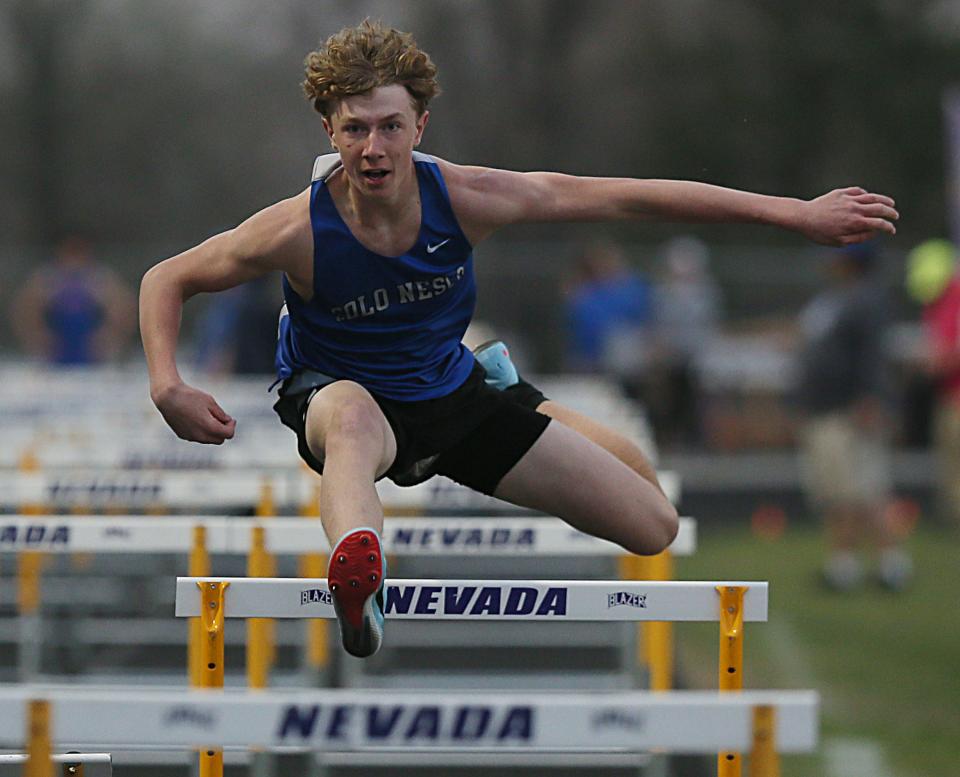 Colo-NESCO's Jack Angell crosses the bar during the boys' 110-meter high hurdles at the Colo-Nesco Dave Robinson Relays at Cubs Stadium on April 14, 2023, in Nevada, Iowa.