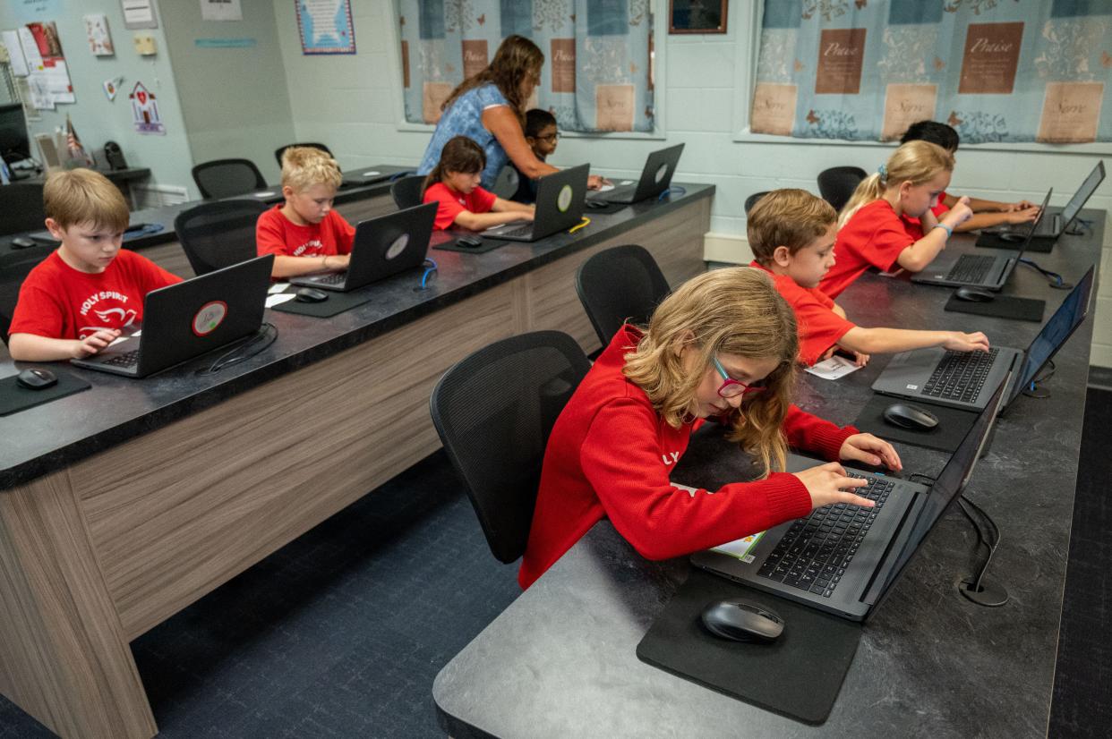 Third grade students work in the computer lab at Holy Spirit Catholic School on Monday. The Jacksonville school is one of just two in Florida recognized in the U.S. Department of Education's 2022 National Blue Ribbon Schools Program.