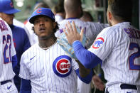 Chicago Cubs starting pitcher Marcus Stroman is greeted in the dugout by Seiya Suzuki, after Stroman worked the first inning of the team's baseball game against the New York Mets on Wednesday, May 24, 2023, in Chicago. (AP Photo/Charles Rex Arbogast)