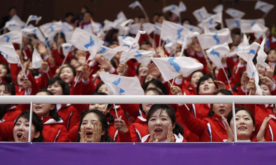 North Korea’s cheerleaders wave flags at Saturday’s short track speedskating events. (REUTERS)
