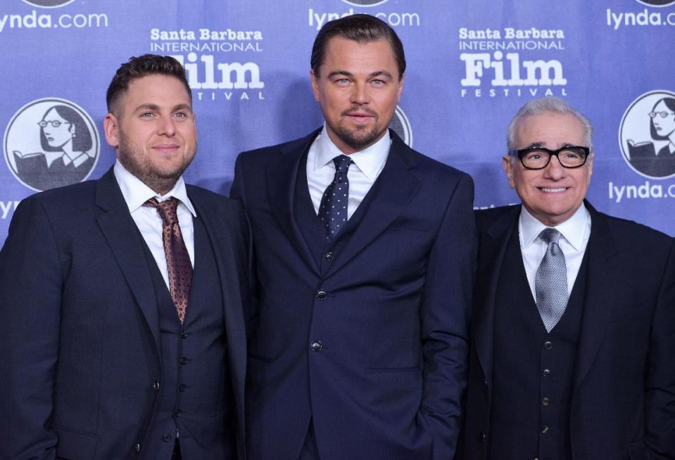 FILE - In this Feb. 6, 2014 file photo, from left, actors Jonah Hill, Leonardo DiCaprio, and director Martin Scorsese arrive at 2014 Santa Barbara International Film Festival - Cinema Vanguard Award ceremony in Santa Barbara, Calif. DiCaprio and Scorsese were the recipients of this year’s Cinema Vanguard Awards at the festival. Scorsese directed DiCaprio and Hill in the film, "The Wolf of Wall Street." (Photo by Richard Shotwell/Invision/AP, file)