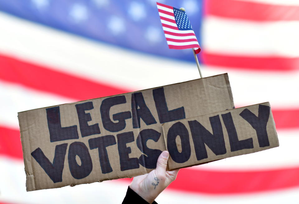 Trump supporter Carri Dusza holds a placard reading "Legal votes only" outside where general election ballots continue to be tabulated, the day after a presidential election victory was called for former Vice President Joe Biden, in Philadelphia, Pennsylvania on November 8, 2020. (Mark Makela/Reuters)