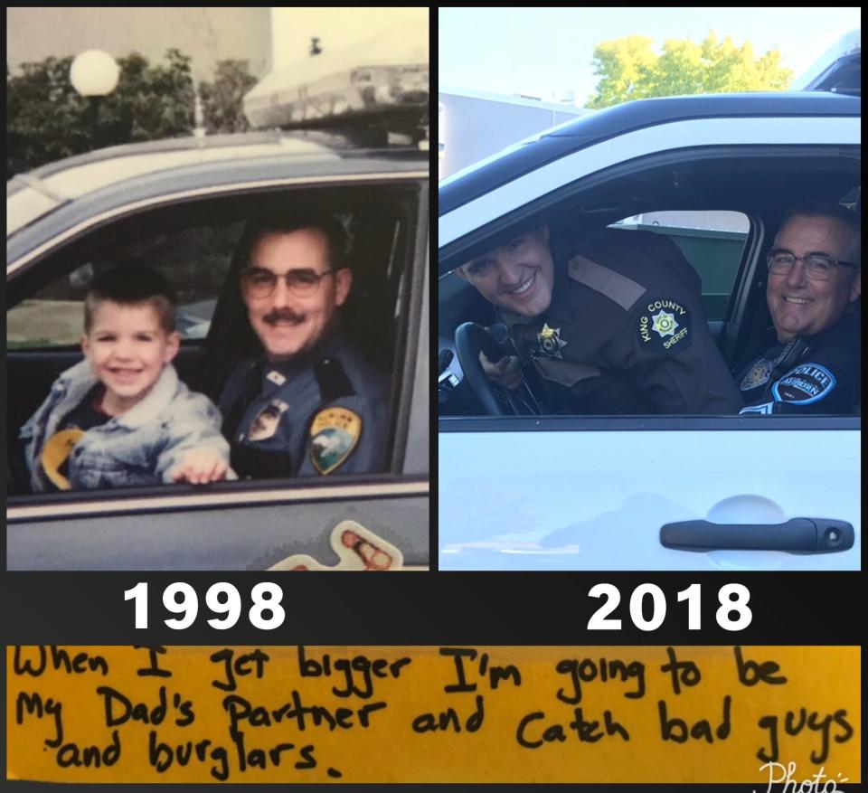 The sweet Father’s Day card from 1998 shows Officer Andrew Gold and his son riding in his patrol vehicle; this year, they reenacted the photo. (Photo: <a href="https://www.facebook.com/AuburnWAPolice/" rel="nofollow noopener" target="_blank" data-ylk="slk:Auburn, Washington Police Department;elm:context_link;itc:0;sec:content-canvas" class="link ">Auburn, Washington Police Department</a>/Facebook )