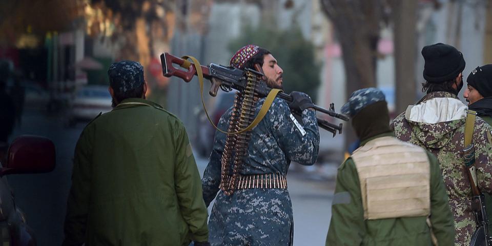 Taliban fighters walking in Kabul on December 9, 2021.