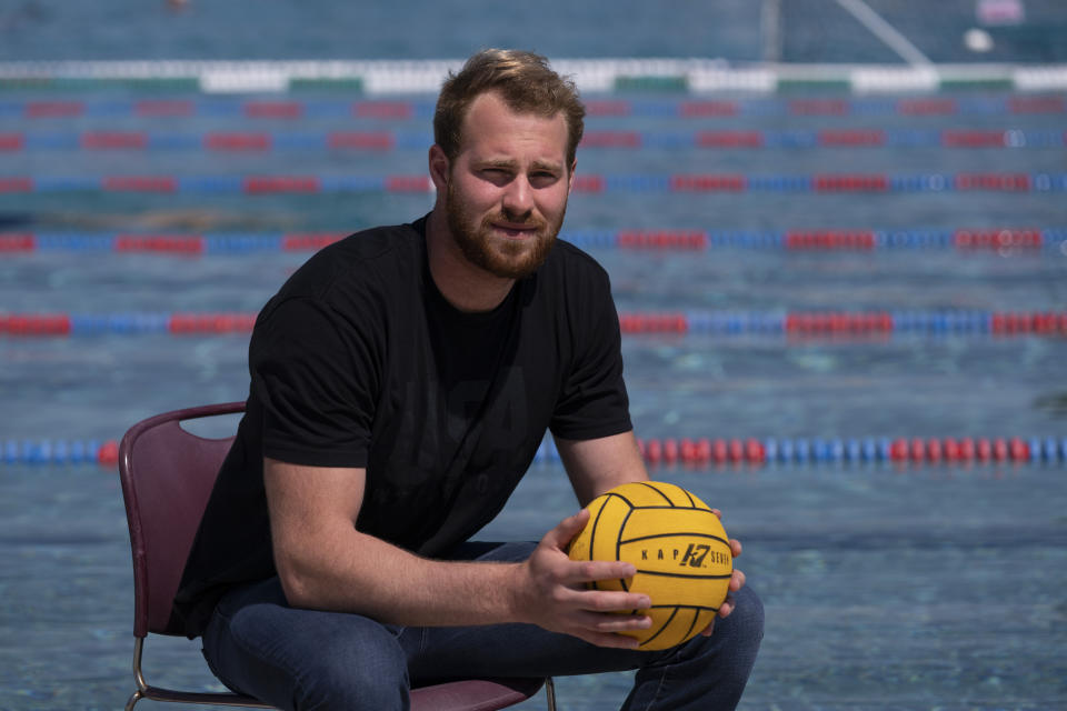 Water polo player Marko Vavic poses for photos at MWR Aquatic Training Center in Los Alamitos, Calif., Tuesday, April 27, 2021. Two years after his father, Jovan, was arrested as part of a college admissions investigation dubbed Operation Varsity Blues, Vavic is pushing for a spot on the U.S. men's Olympic water polo team. (AP Photo/Jae C. Hong)