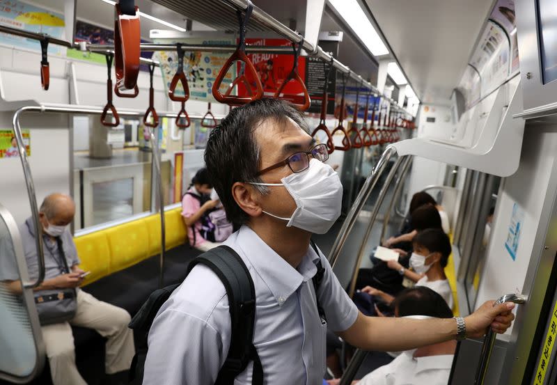 Doctor Shoji Yokobori rides in a subway train as he heads to Tokyo International Forum