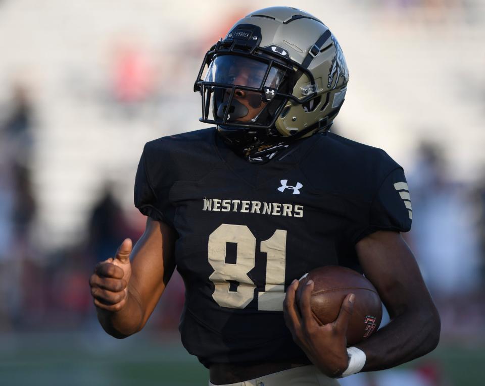 Lubbock High's Da'Zaun Jones returns the opening kickoff for a touchdown against Levelland on Thursday, Sept. 8, 2022, at Lowrey Field at PlainsCaptial Park. Lubbock High won, 21-14.