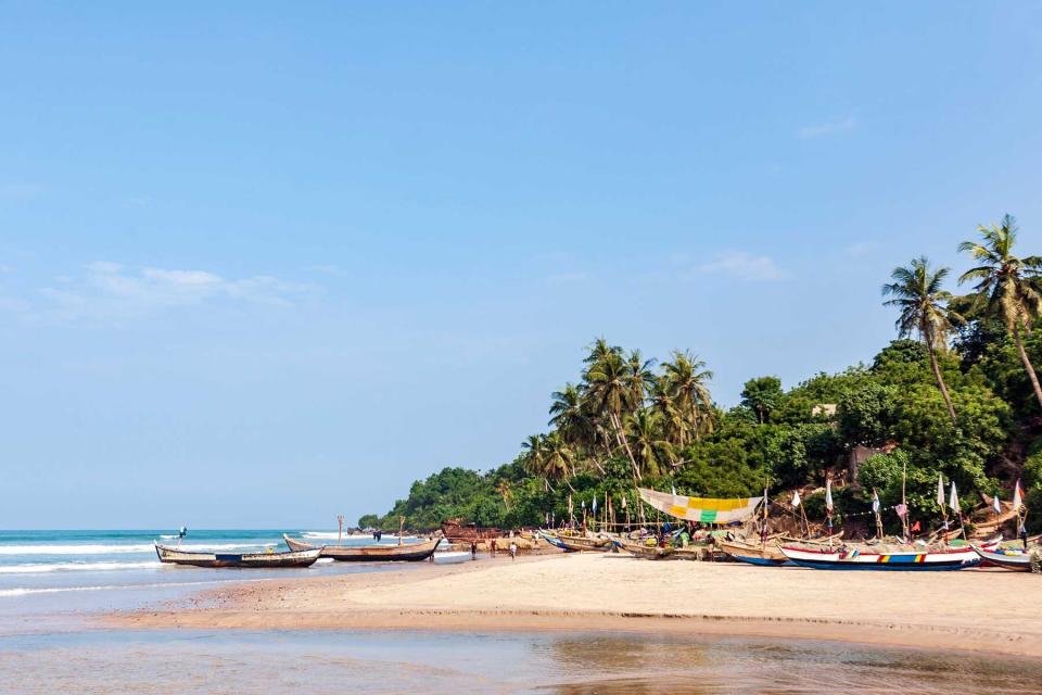 Beachside village with wooden fishing boats on the Atlantic Ocean in Accra, Ghana