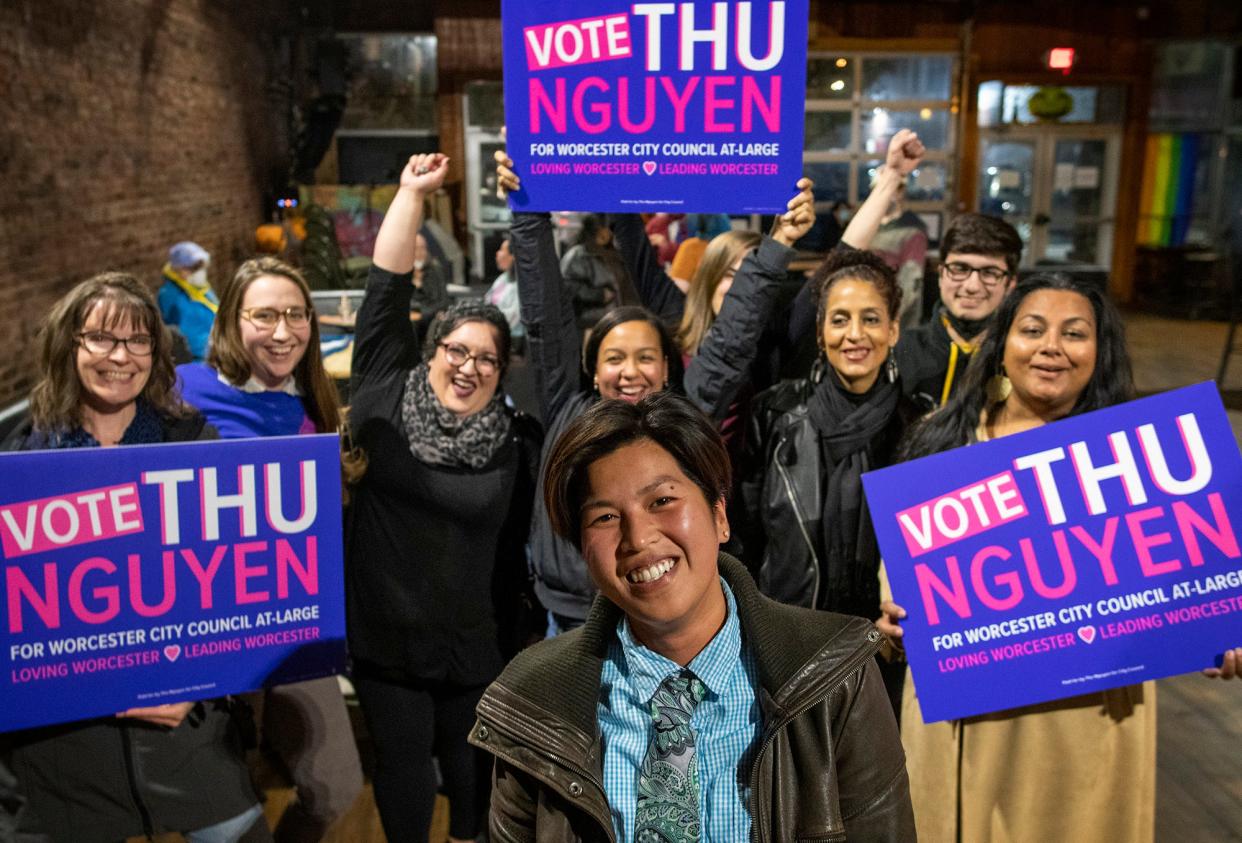 WORCESTER - Thu Nguyen is surrounded by supporters at an after-election party at Electric Haze on Tuesday.