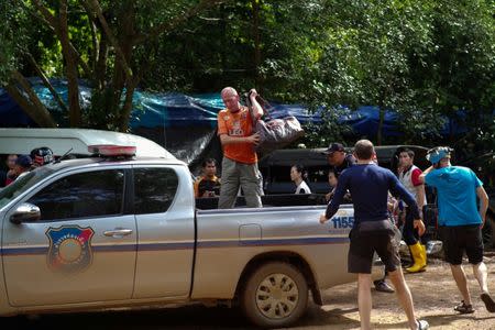 FILE PHOTO: British caver Vernon Unsworth (C) gets out of a pick up truck near the Tham Luang cave complex, where 12 boys and their soccer coach are trapped, in the northern province of Chiang Rai, Thailand, July 5, 2018. REUTERS/Panu Wongcha-um/File Photo
