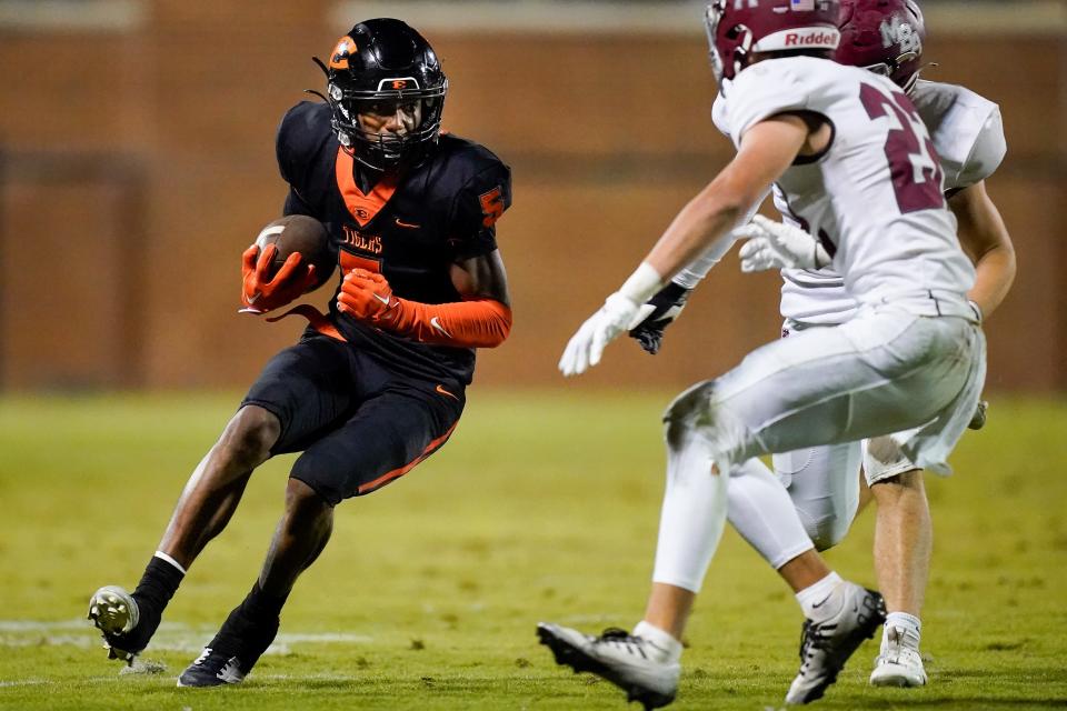 Ensworth’s Jaren Sensabaugh (5) looks for an opening past MBA’s Eli Kirkland (23) during the second quarter at Ensworth High School in Nashville, Tenn., Friday, Nov. 10, 2023.