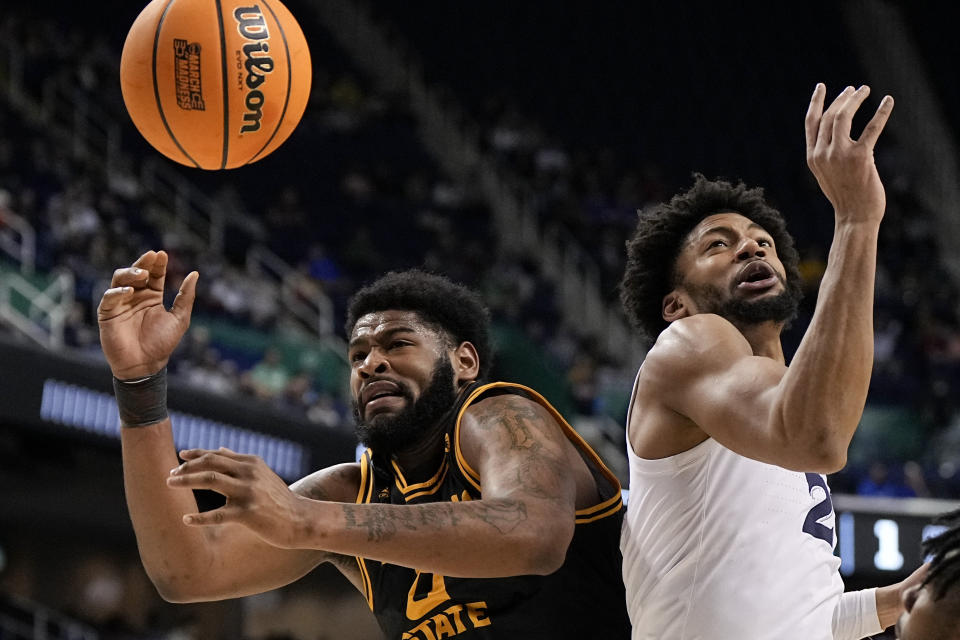 Kennesaw State forward Demond Robinson vies for the ball with Xavier forward Jerome Hunter during the first half of a first-round college basketball game in the NCAA Tournament on Friday, March 17, 2023, in Greensboro, N.C. (AP Photo/Chris Carlson)