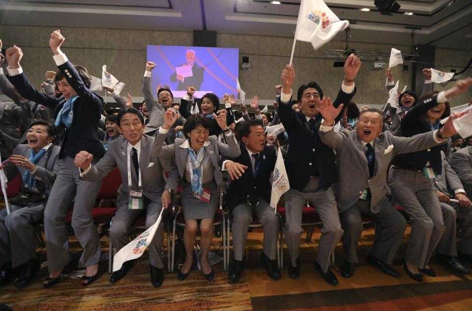 Prime Minister Shinzo Abe of Japan (2nd R) celebrates with members of the Tokyo bid committee as Jacques Rogge President of the International Olympic Committee (IOC) announces Tokyo as the city to host the 2020 Summer Olympic Games during a ceremony in Buenos Aires September 7, 2013. REUTERS/Ian Walton/Pool (ARGENTINA - Tags: SPORT OLYMPICS POLITICS)