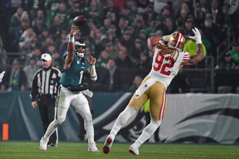 Dec 3, 2023; Philadelphia, Pennsylvania, USA; Philadelphia Eagles quarterback Jalen Hurts (1) throws a pass over San Francisco 49ers defensive end Chase Young (92) during the first quarter at Lincoln Financial Field. Mandatory Credit: Eric Hartline-USA TODAY Sports