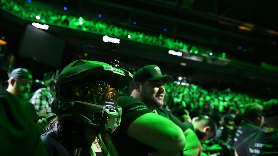 An E3 attendee wears Master Chief's helmet during an Xbox briefing. (Robyn Beck/AFP via Getty Images)
