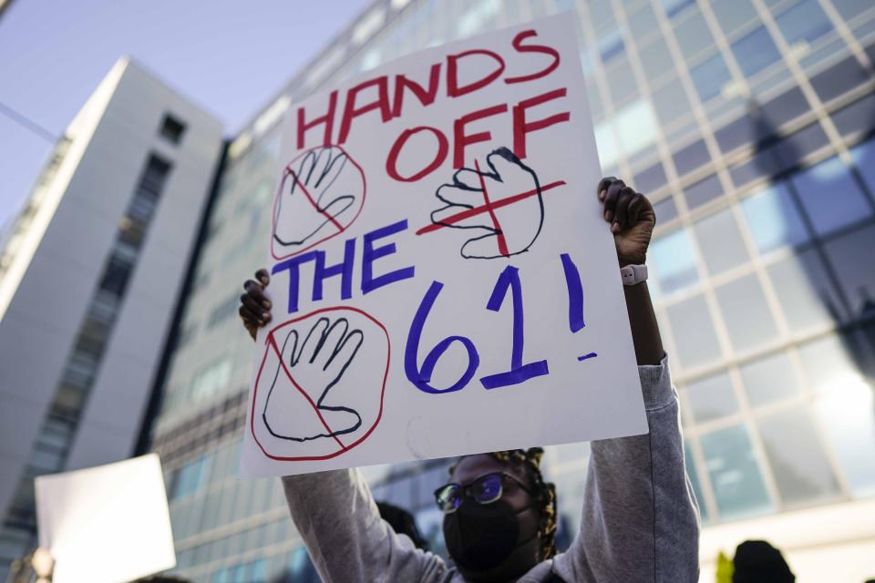 Demonstrators protest 61 defendants that are being arraigned on RICO charges related to vandalism at the site of the new Public Safety Training Center, outside the a Fulton County courthouse, Monday, Nov. 6, 2023, in Atlanta. (AP Photo/Mike Stewart)