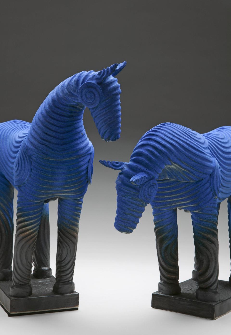 This undated publicity photo provided by Bill Sanders shows blue ceramic horses. Sanders, who worked in lumber and wood flooring for 20 years, honed the ceramic skills he learned as a teenager growing up in the Philippines after selling his business in the late 1990s. Now living in Steamboat Springs, Colo., with his artist wife, Barbara, Sanders, 64, creates ceramic sculptures, such as the horses featured here. (AP Photo/Bill Sanders, Tim Murphy)