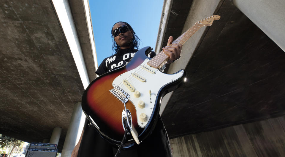 Steve Lacy holds his new signature Fender 