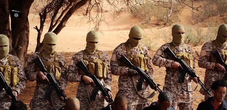 Image grab taken on April 19, 2015 from a video reportedly released by the IS group purportedly shows Ethiopian Christians captured in Libya kneeling in front of masked militants before their execution in a desert area in Libya