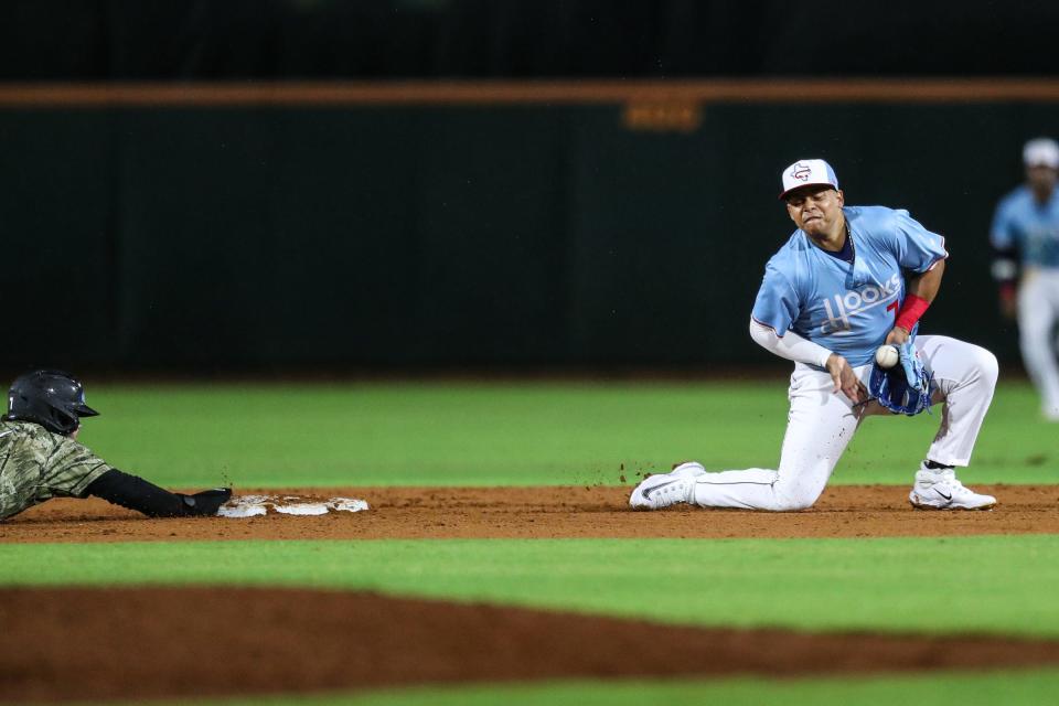Hooks second baseman J.C. Correa attempts to force an out during the game against the Arkansas Travelers at Whataburger Field on April 6, 2023. 