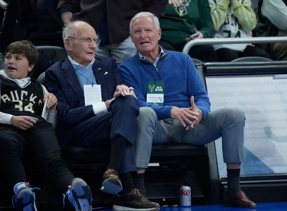 Jimmy Haslam, right, watches Sunday's Milwaukee Bucks game against the Phoenix Suns on Sunday at Fiserv Forum. Haslam's ownership group has reportedly bought Marc Lasry's stake in the franchise.