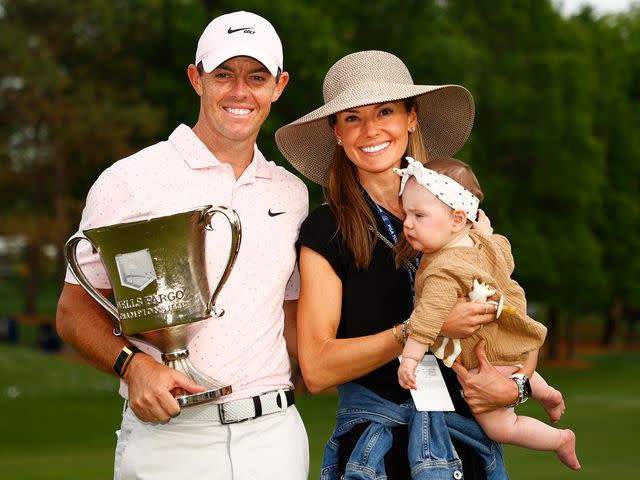 <p>Jared C. Tilton/Getty</p> Rory McIlroy and Erica Stoll with their daughter, Poppy, at the 2021 Wells Fargo Championship.