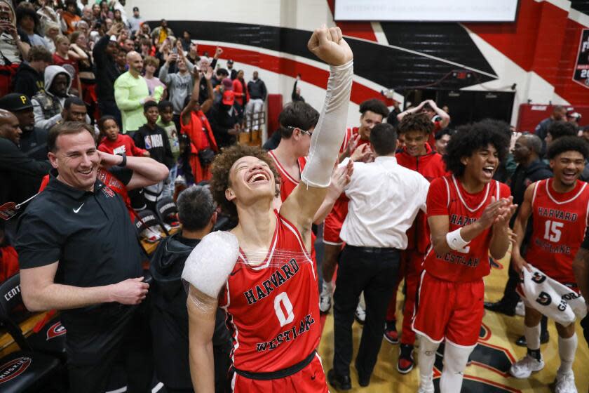 CORONA , CA - MARCH 07: Harvard-Westlake point guard Trent Perry (0) celebrates after winning the Southern California Open Division regional final against Corona Centennial 80-61 on Tuesday, March 7, 2023 in Corona , CA. (Jason Armond / Los Angeles Times)