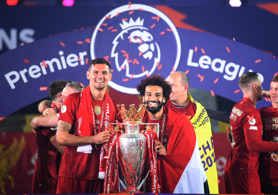 Liverpool's Dejan Lovren (left) and Mohamed Salah celebrate with the Premier League trophy after the Premier League match at Anfield, Liverpool. (Photo by Laurence Griffiths/PA Images via Getty Images)